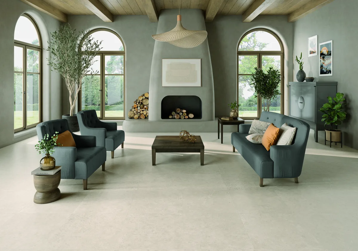 A living room with arched windows and the fire lit