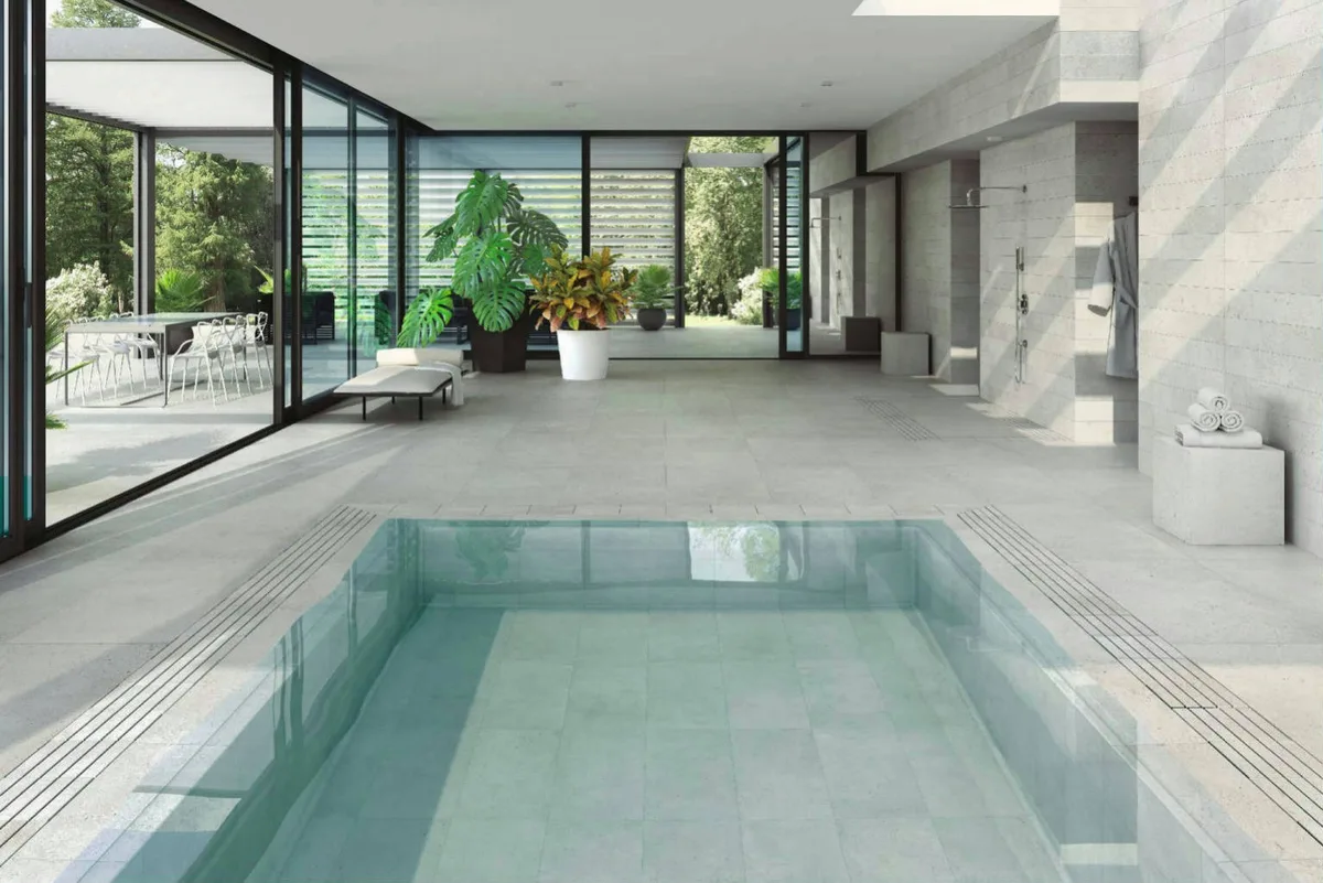 An indoor pool open to the garden